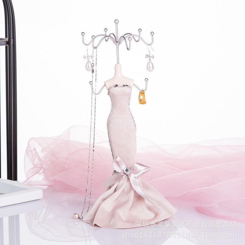 Iron rack holding beautiful earrings and necklaces