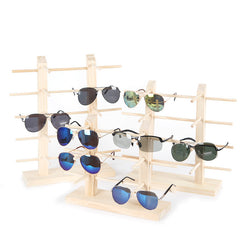 Stylish wood stand holding sunglasses