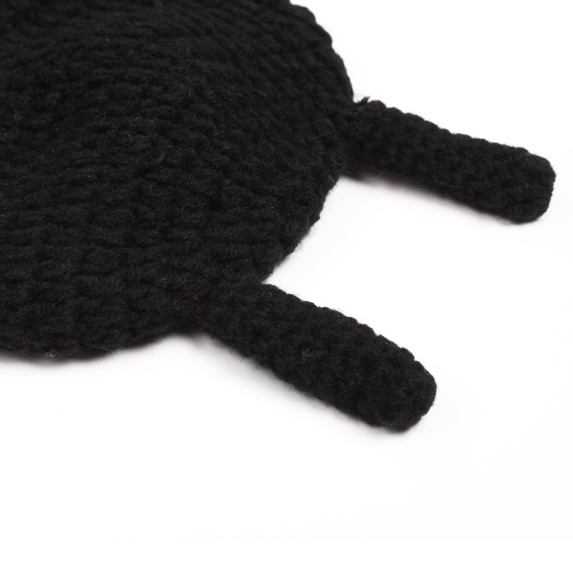 Close-up of beetle-themed crochet baby hat