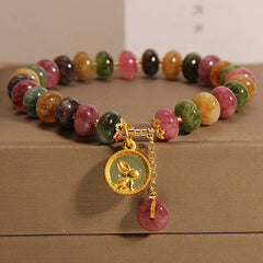 Natural colour tourmaline bracelet on white background