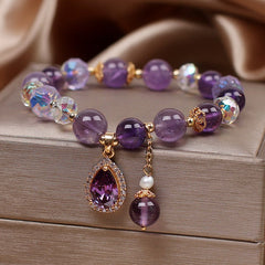 Close-up of heart pendant design on bracelet