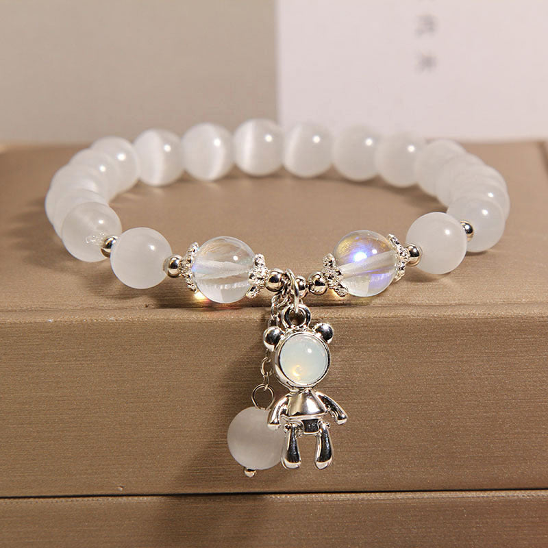 Close-up of cat's eye beaded bracelet on display