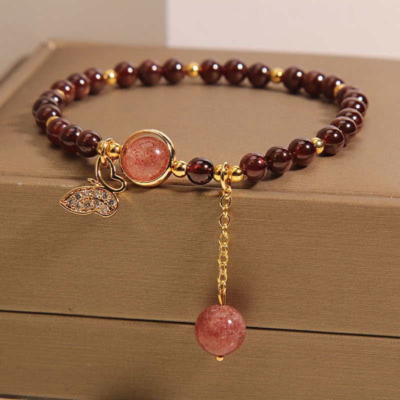 Close-up image of the butterfly charm bracelet