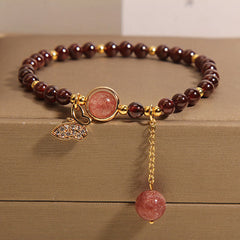 Garnet crystal bracelet with multiple charms