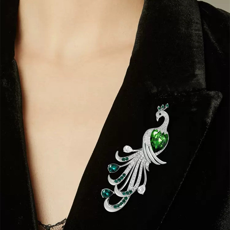 Elegant green brooch against cloth background