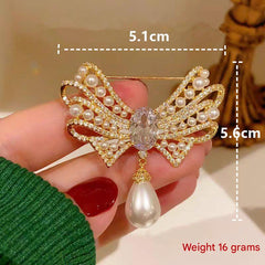 Elegant gold bow brooch on clothing