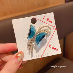 Close-up of butterfly brooch with intricate crystal design