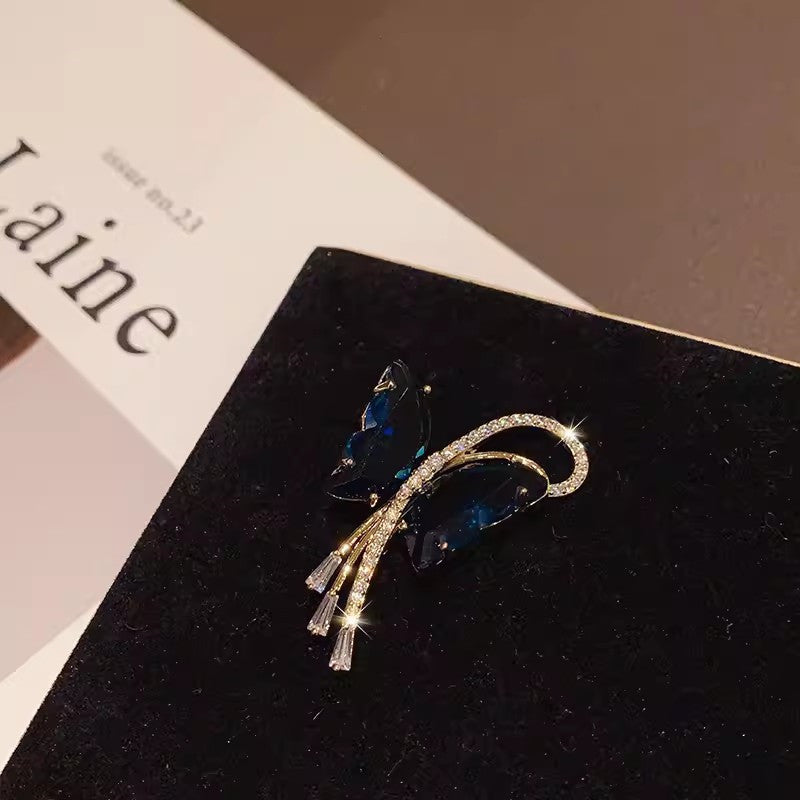 Butterfly brooch showcased on a model