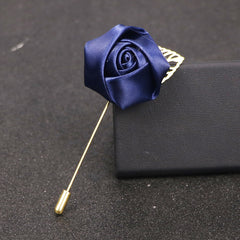 detailed view of red rose brooch