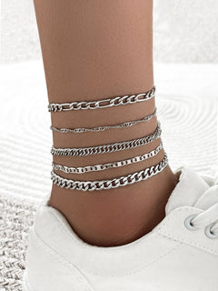 Elegant metal anklet worn on a woman's ankle