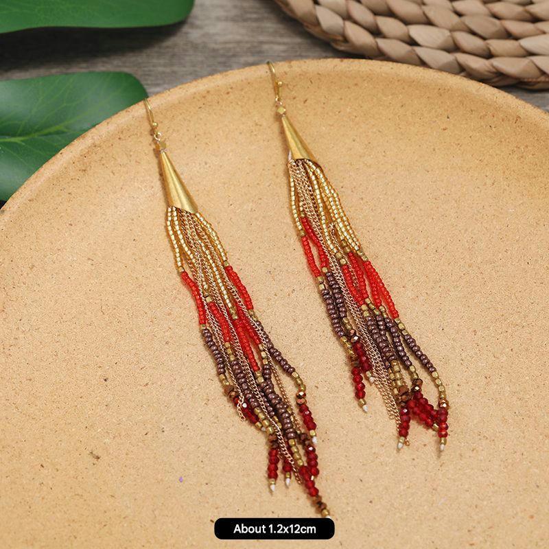 Close-up of vintage chic long tassel earrings