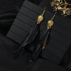 Handcrafted earrings with feather details