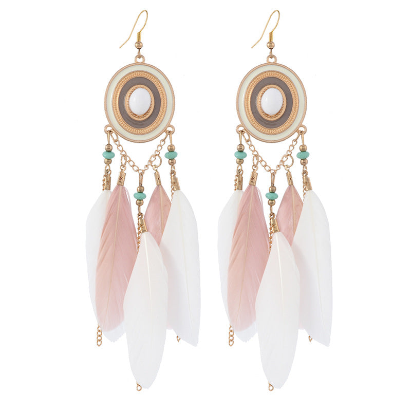 feather earrings in pastel hues