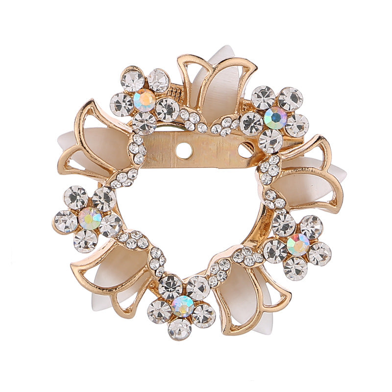 Brooch securing a scarf elegantly