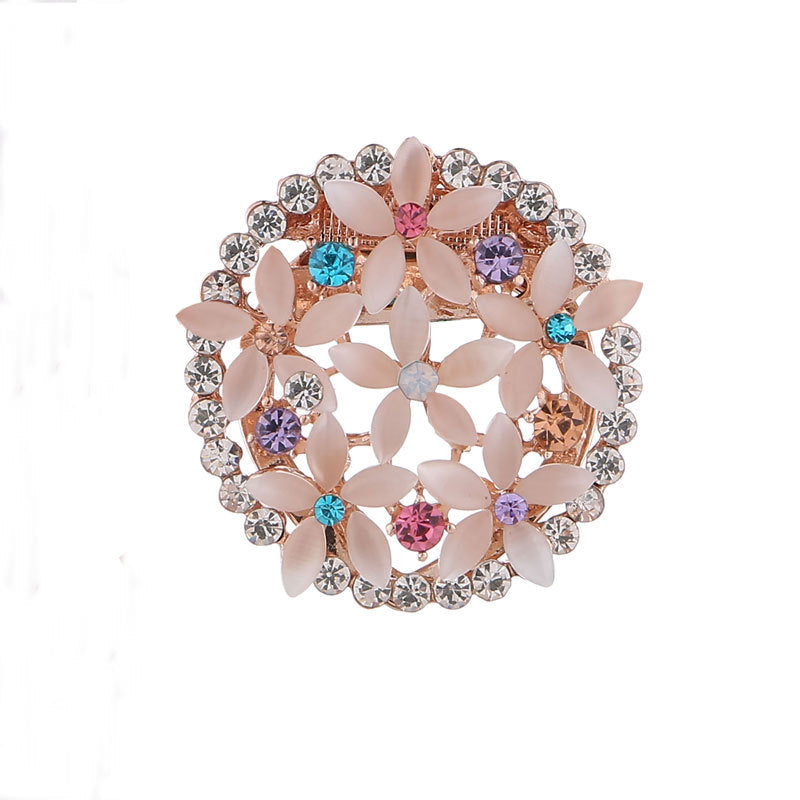 Floral rhinestone brooch on fabric