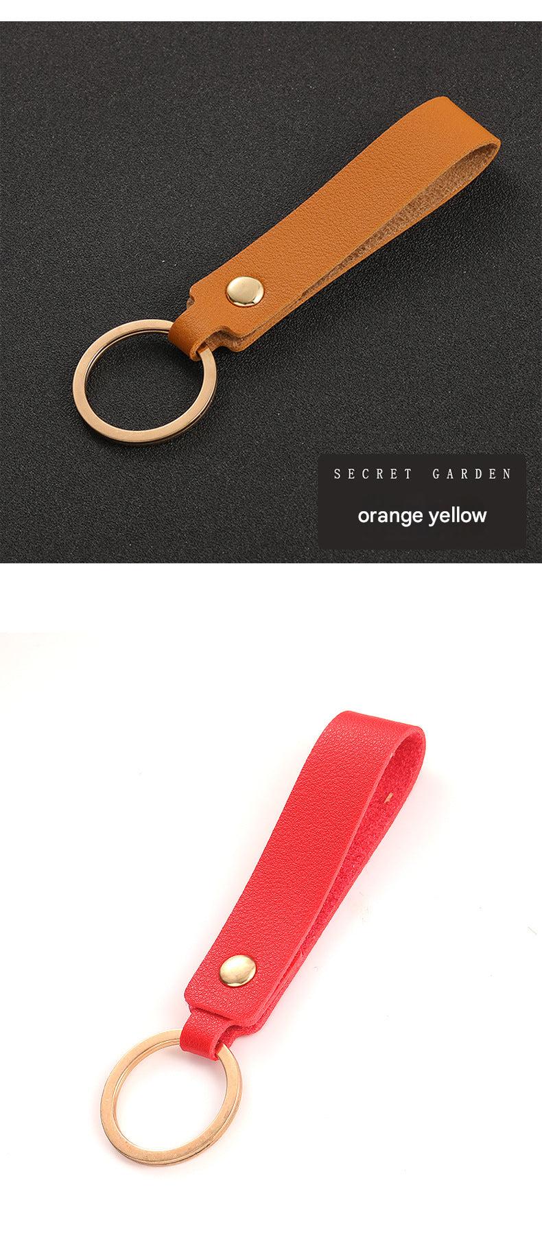 Minimalist keyring holder displayed with accessories