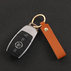 Assortment of colourful PU leather keychains displayed