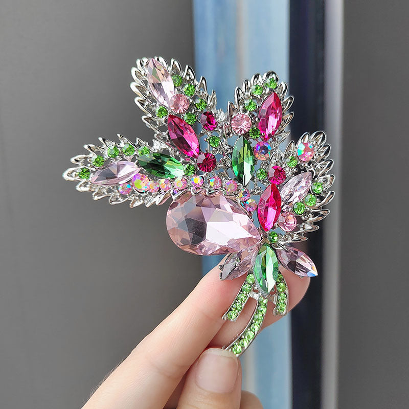 Elegant crystal floral brooch in blue