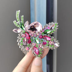 Purple floral brooch on display