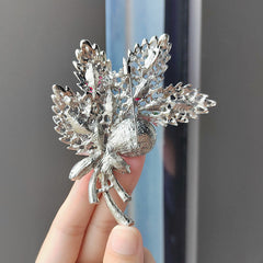 Close up of crystal floral brooch detail