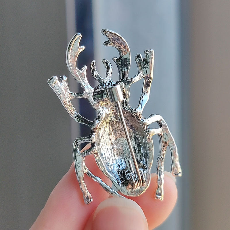 Vintage Beetle Brooch displayed on a scarf