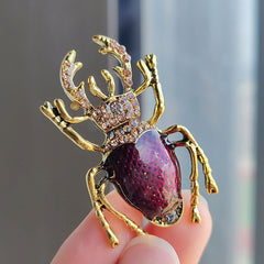 Fashionable beetle pin worn by a model