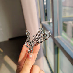 Elegant brooch displayed on fabric - image 10