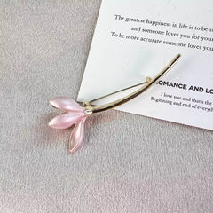 Elegant lotus flower pin worn on a jacket