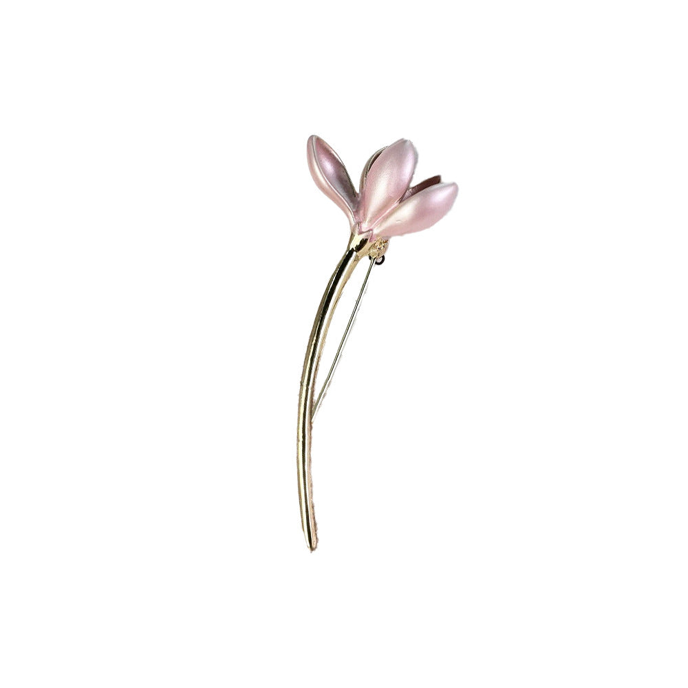 Pink Lotus Flower Brooch on black fabric background