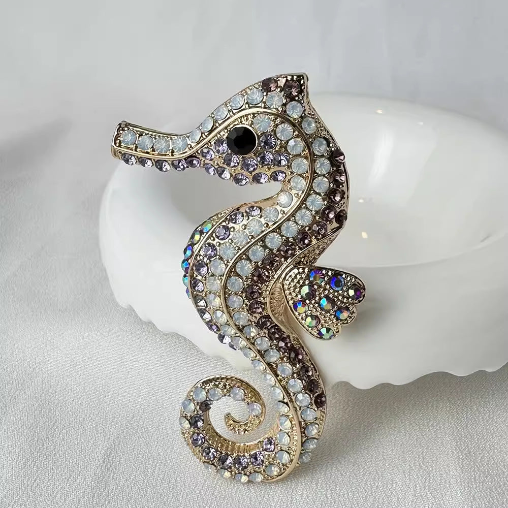 Purple sea horse brooch on display
