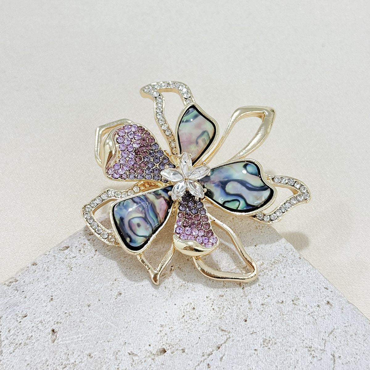 Elegant brooch accessory displayed on a sweater