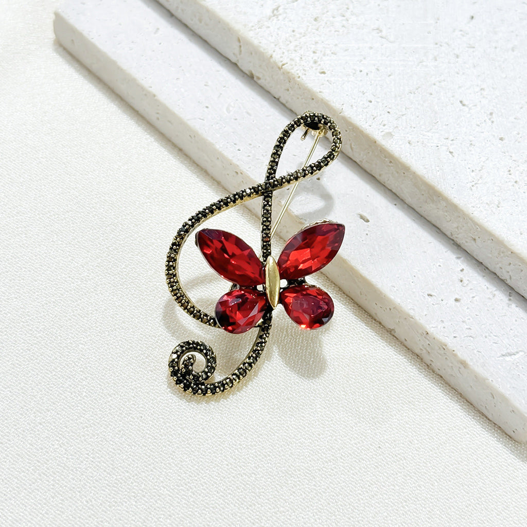 Full view of butterfly crystal note brooch