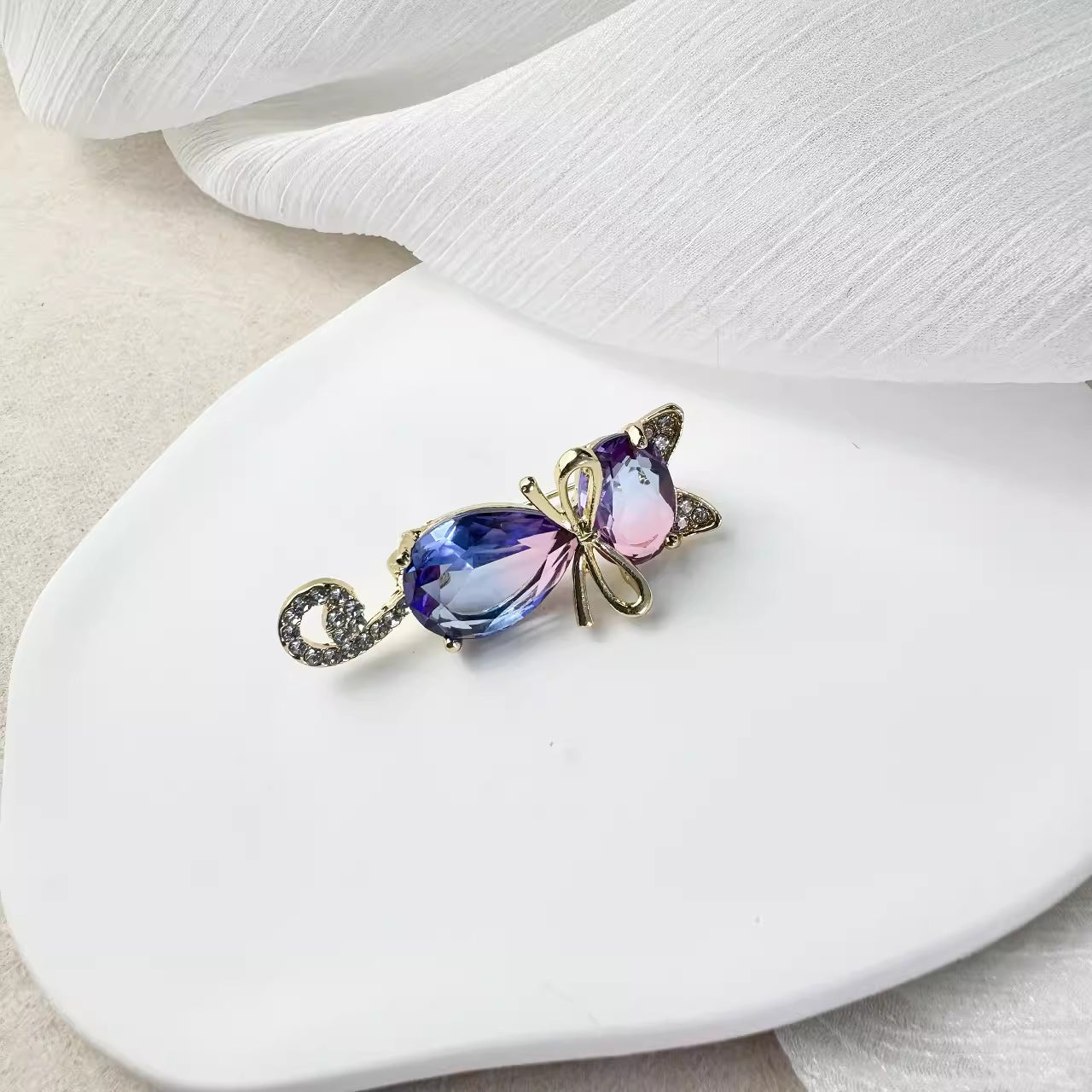 Cat brooch on elegant background
