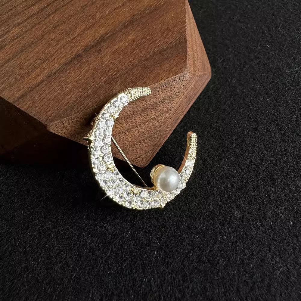 dazzling rhinestone brooch display with moon design