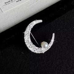 gold moon brooch with sparkling details