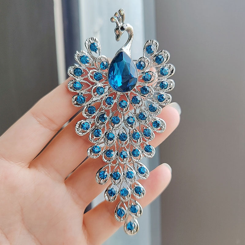 Sparkling rhinestone peacock brooch pin close-up