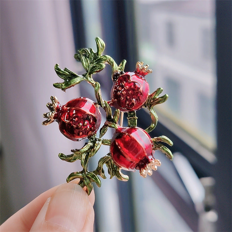 Brooch displaying multiple vibrant fruit designs