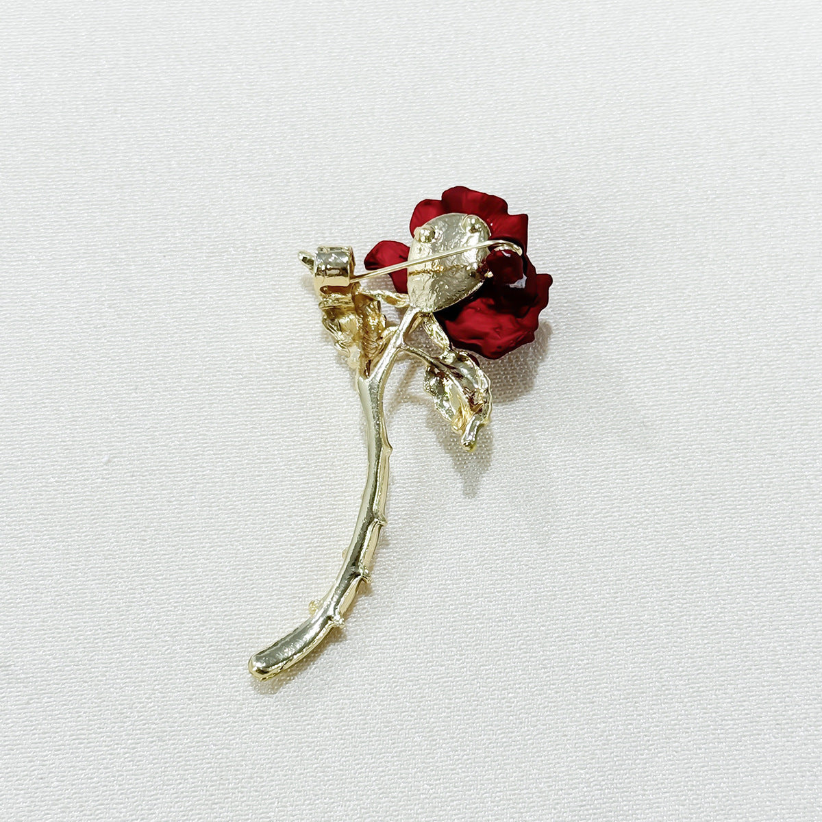 Close-up of Elegant Red Rose Brooch details