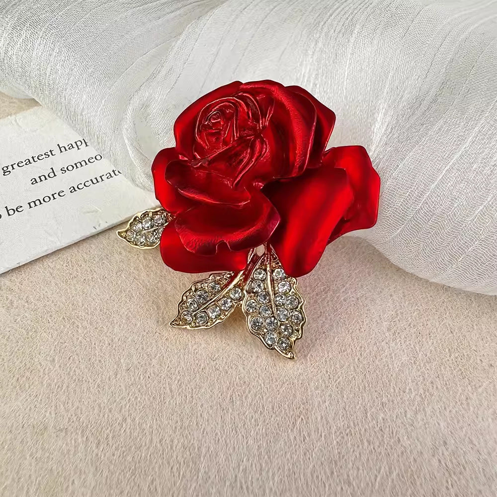 Elegant rose brooch displayed on a coat