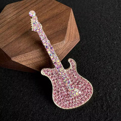 Close-up of rhinestone detail on guitar brooch