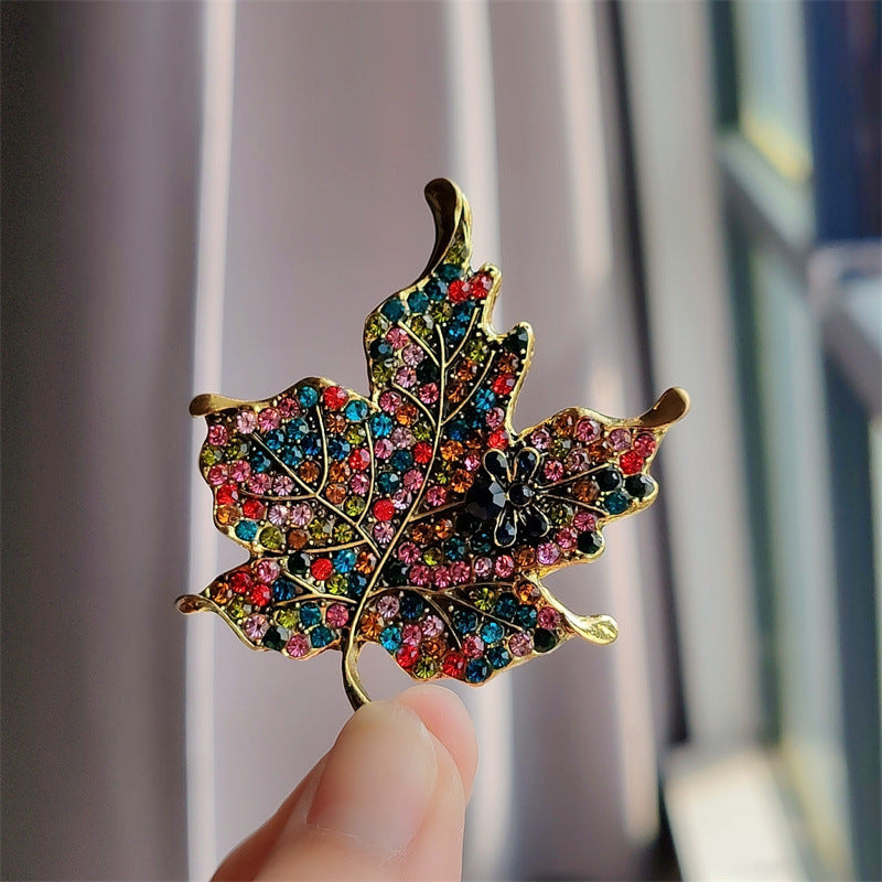 Brooch styled on a black fashion outfit