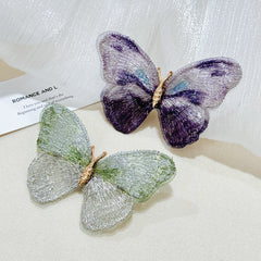 Elegant vintage floral pin in purple