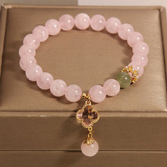 Stylish pink quartz bracelet displayed elegantly