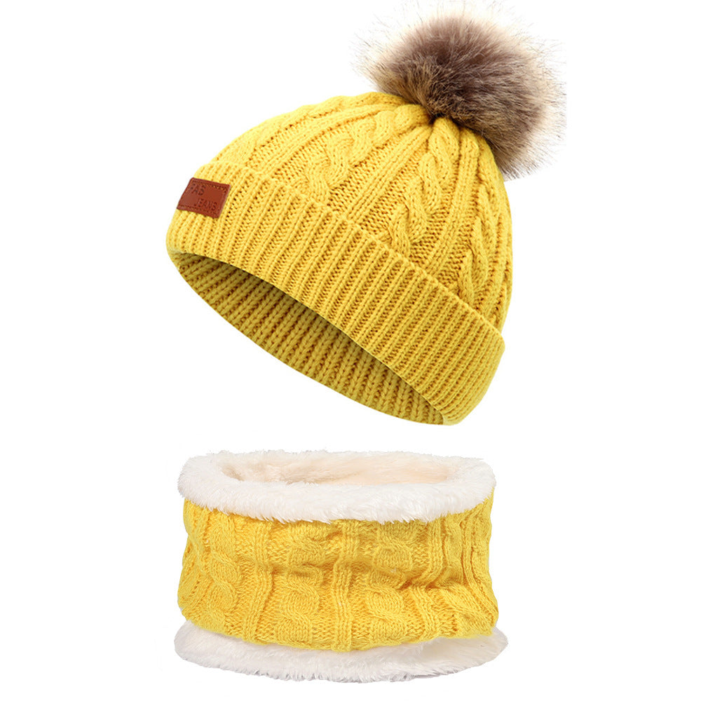 Kids winter knit hat with pom-pom in yellow