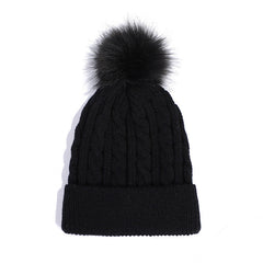 Red knit beanie hat with trendy pom pom