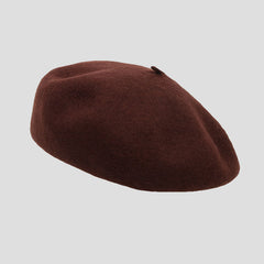 Close-up of round top wool beret design