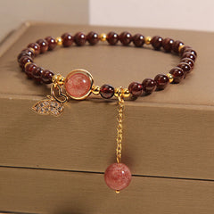 Close-up detail of garnet crystal charm