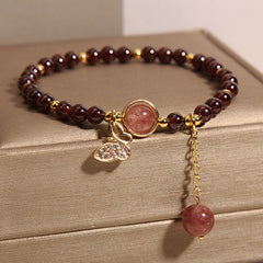Vintage garnet bracelet showcasing butterfly design
