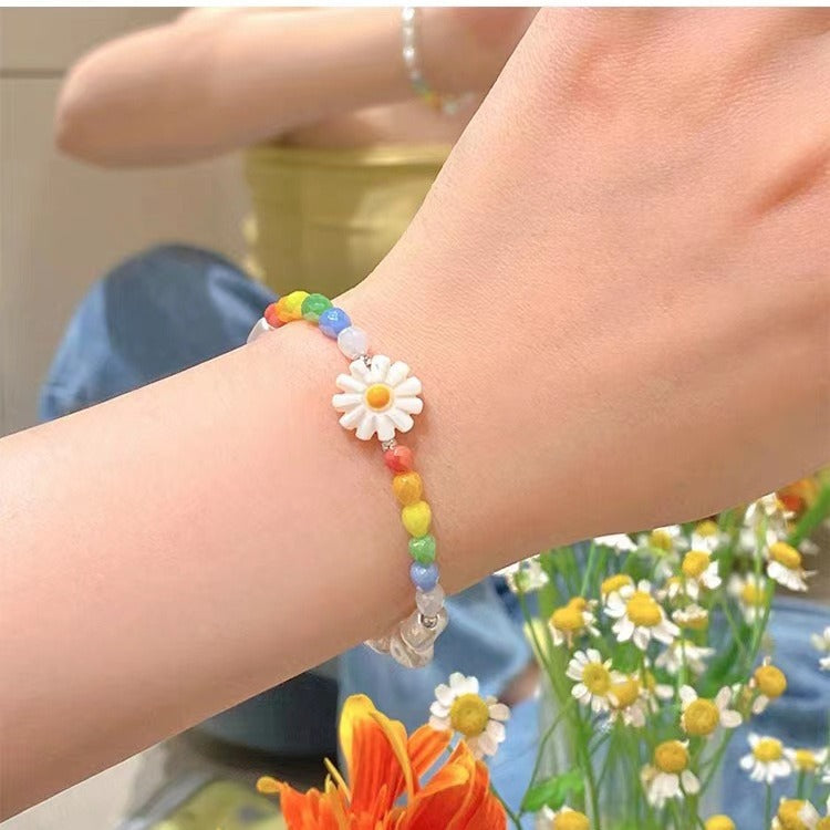 model wearing colourful floral necklace
