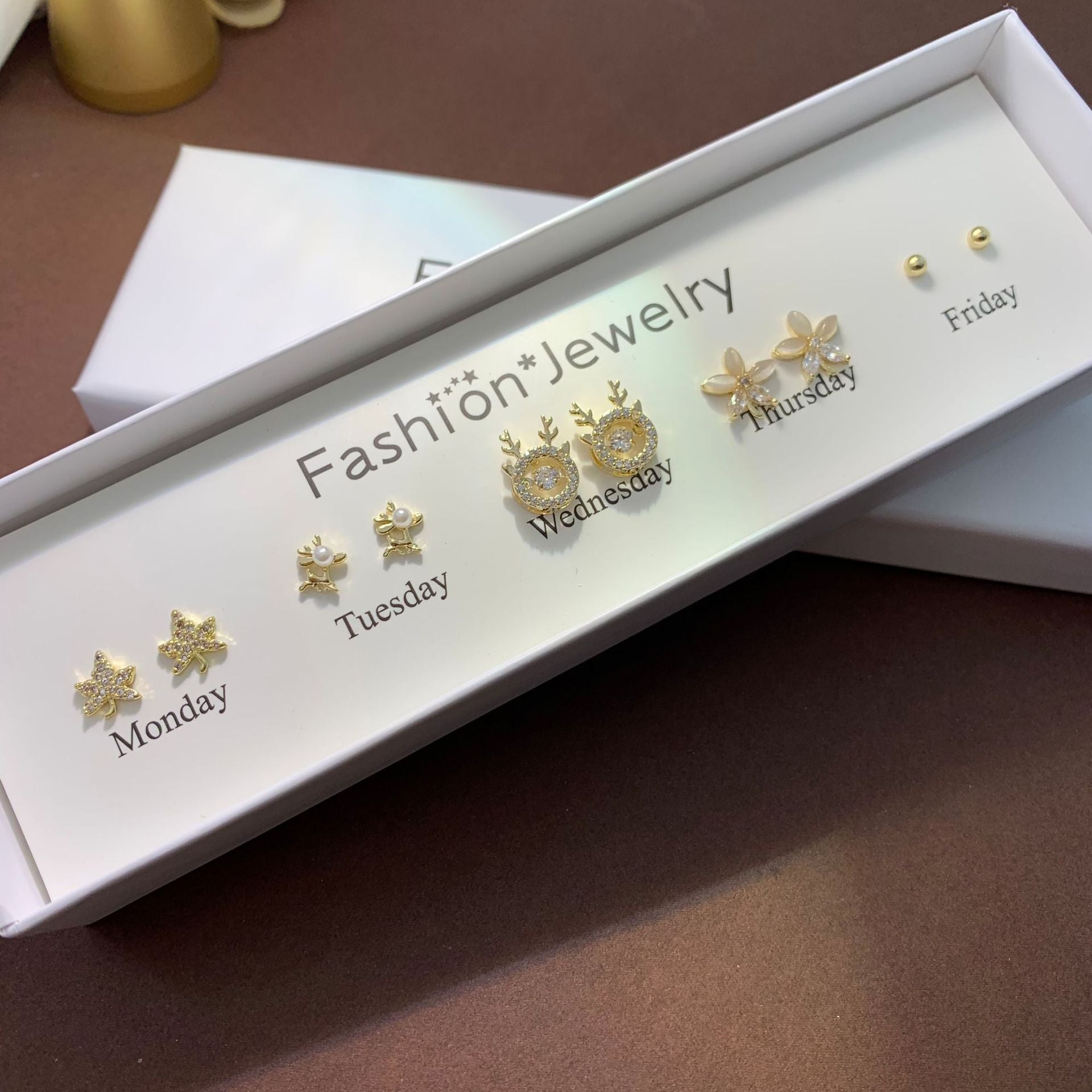 Playful heart cat ear studs elegantly displayed